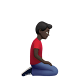 homme à genoux : peau foncée et vers la droite